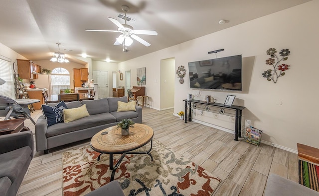 living area featuring visible vents, baseboards, lofted ceiling, wood tiled floor, and ceiling fan with notable chandelier