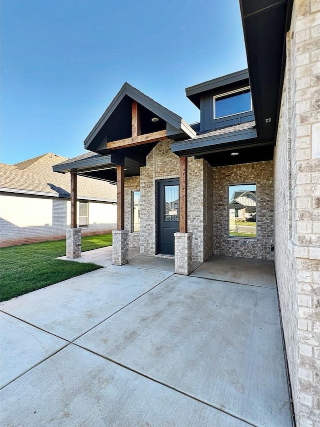 view of front facade with a patio area