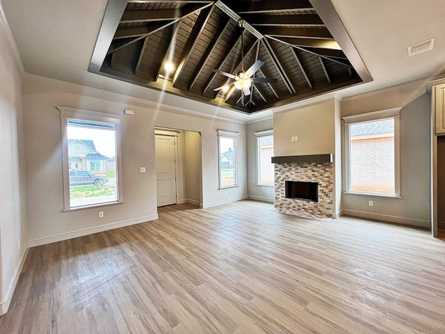 unfurnished living room with crown molding, wood ceiling, light hardwood / wood-style flooring, ceiling fan, and a fireplace