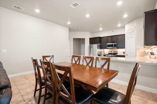 dining room with light tile patterned floors