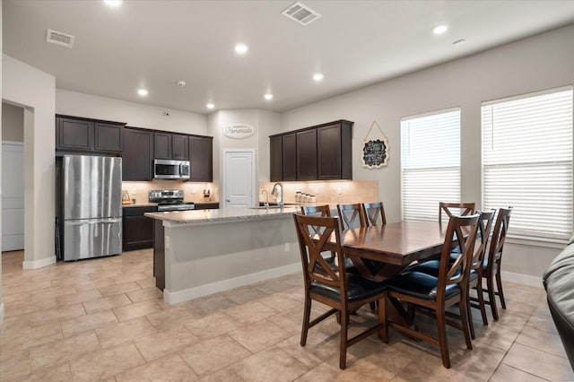 dining room featuring sink