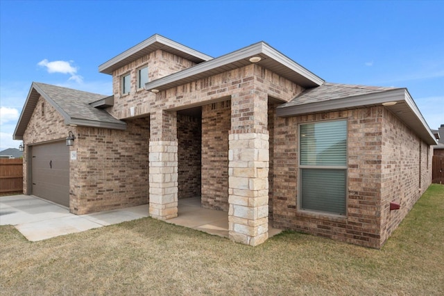 view of home's exterior featuring a yard and a garage