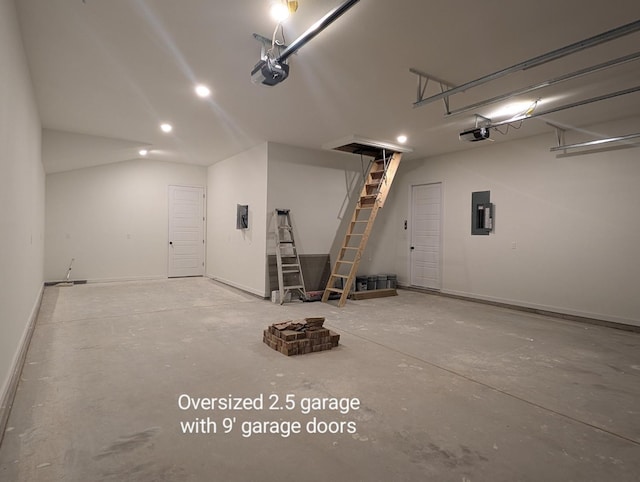 garage with a garage door opener and electric panel