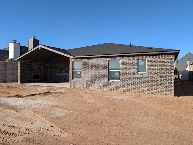 rear view of property featuring a patio