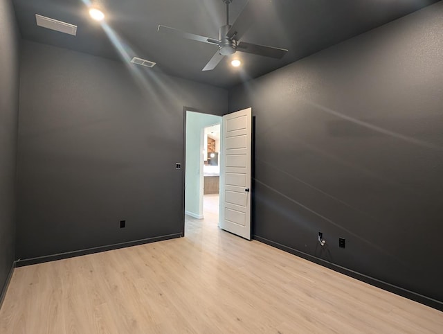 unfurnished room featuring ceiling fan and light hardwood / wood-style floors