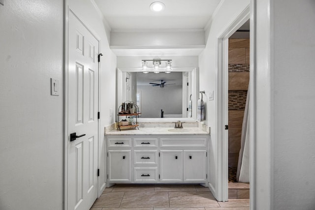 bathroom with vanity and crown molding