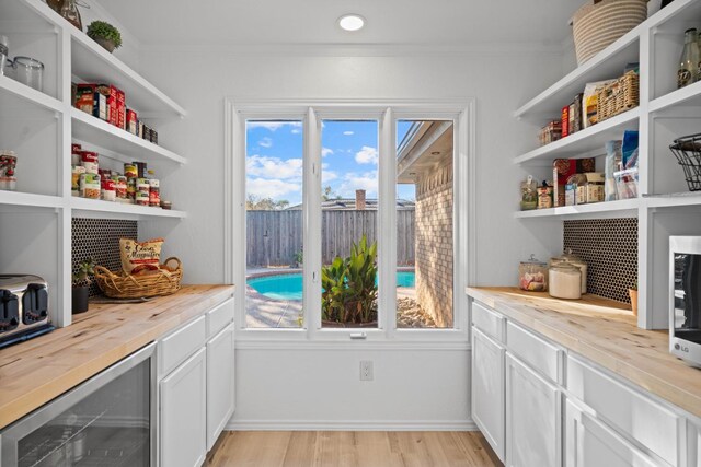 pantry featuring wine cooler