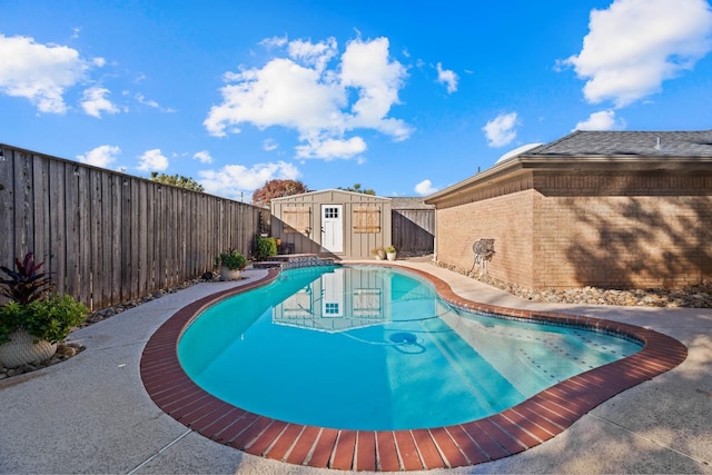 view of swimming pool with a storage unit