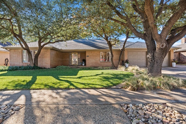 ranch-style home with a garage and a front yard