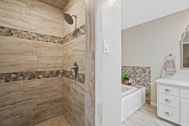 bathroom with vanity and independent shower and bath