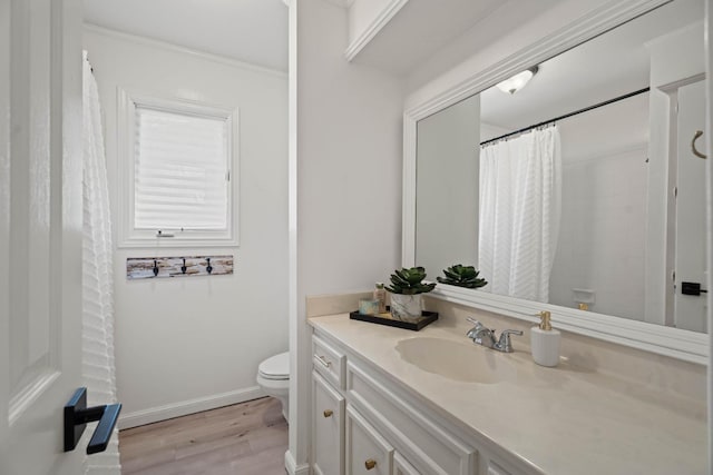 bathroom with hardwood / wood-style flooring, vanity, toilet, and a shower with shower curtain