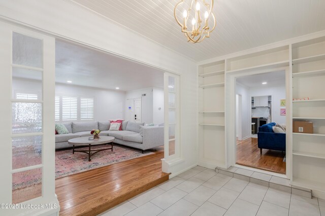 3014 25th St, Lubbock, TX 79410 - tiled living room with built in shelves and a chandelier