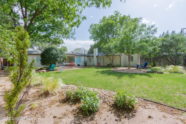 3014 25th St, Lubbock, TX 79410 - view of green lawn with a patio area