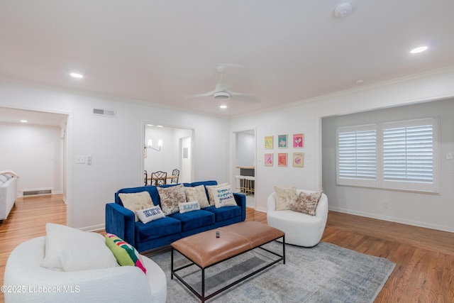 3014 25th St, Lubbock, TX 79410 - living area featuring ornamental molding, light wood-style flooring, recessed lighting, a ceiling fan, and baseboards