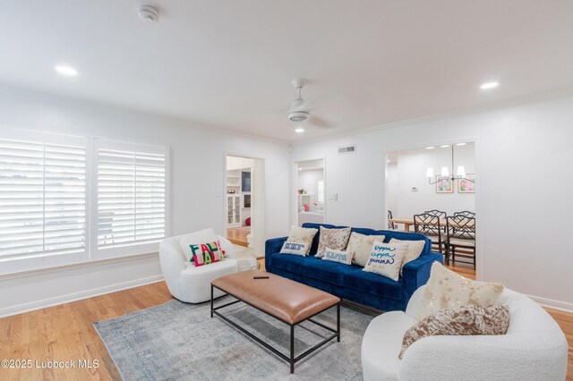 3014 25th St, Lubbock, TX 79410 - living area featuring ceiling fan, wood finished floors, ornamental molding, a chandelier, and baseboards