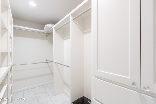 3014 25th St, Lubbock, TX 79410 - spacious closet with light marble finish flooring