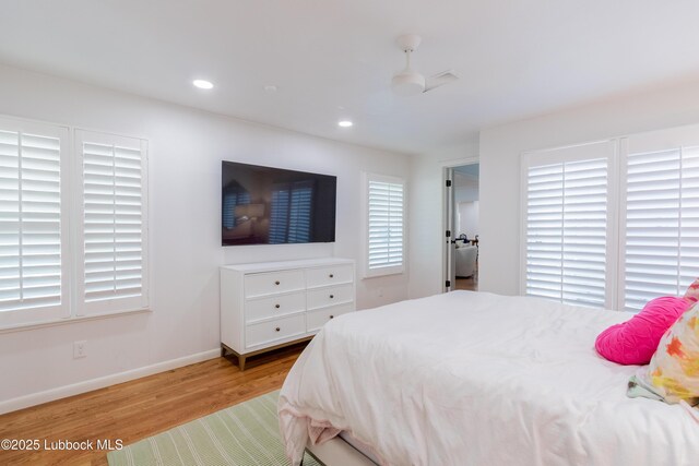 3014 25th St, Lubbock, TX 79410 - bedroom featuring wood finished floors, baseboards, and recessed lighting