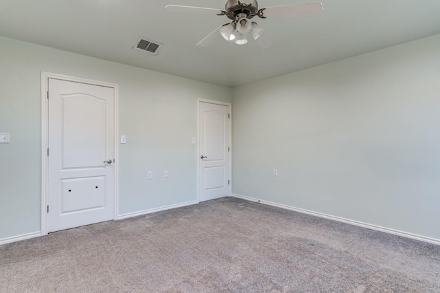 spare room with light carpet and ceiling fan