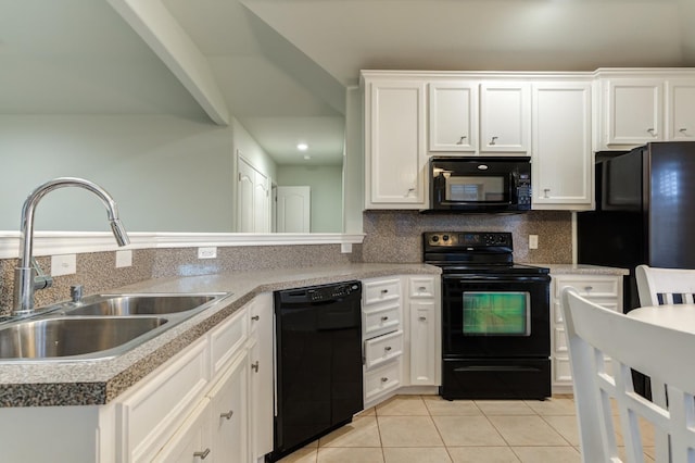 kitchen featuring white cabinetry, sink, and black appliances