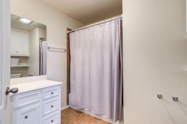 bathroom featuring tile patterned flooring and vanity