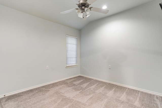 unfurnished room featuring ceiling fan, lofted ceiling, and carpet floors