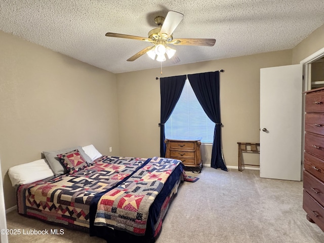 5226 92nd St, Lubbock, TX 79424 - bedroom featuring carpet flooring, a textured ceiling, and a ceiling fan