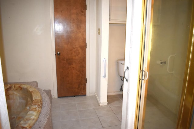 bathroom with plus walk in shower and tile patterned flooring