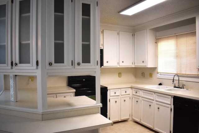 kitchen with sink, white cabinetry, a textured ceiling, light tile patterned floors, and dishwasher