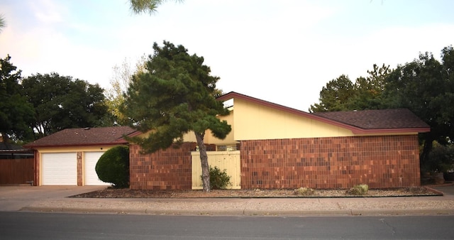 view of property exterior with a garage