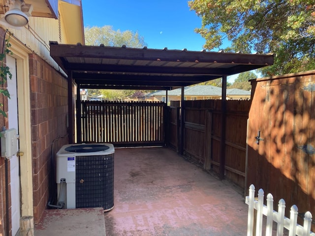 view of parking / parking lot featuring a carport