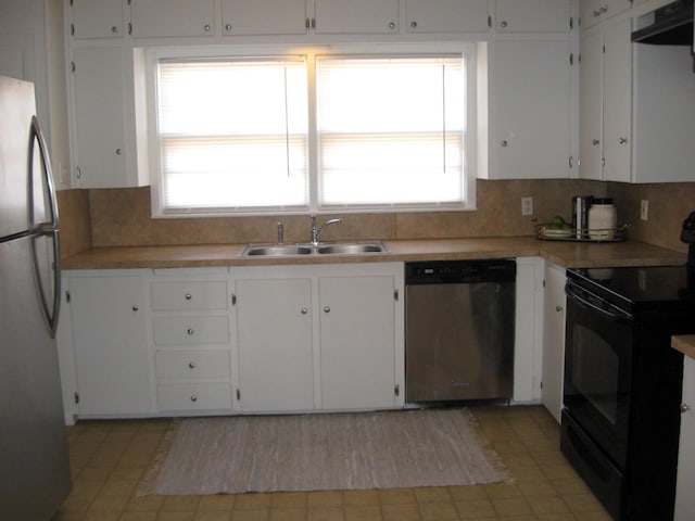 kitchen with stainless steel appliances, white cabinetry, sink, and extractor fan