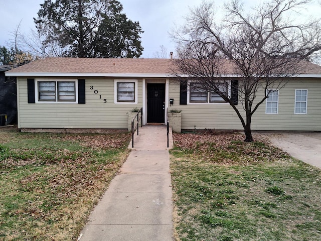 ranch-style house with a front yard