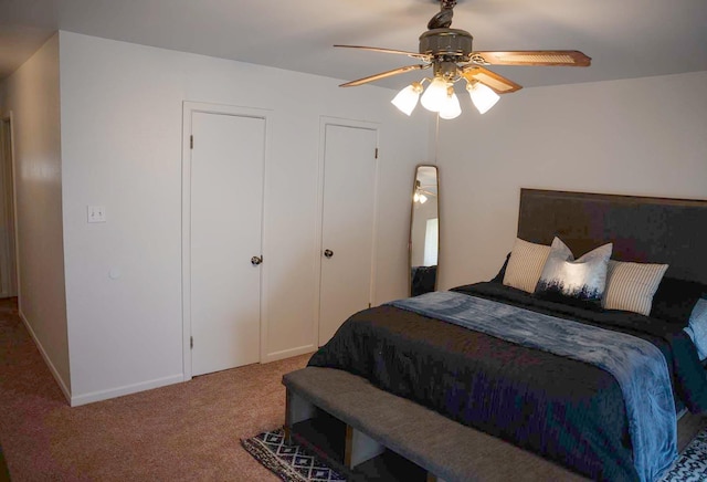 bedroom featuring ceiling fan and carpet