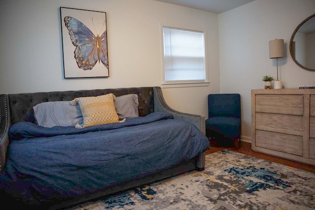 bedroom with hardwood / wood-style floors