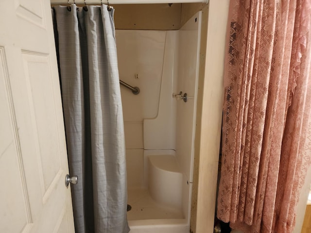 bathroom with a shower with shower curtain