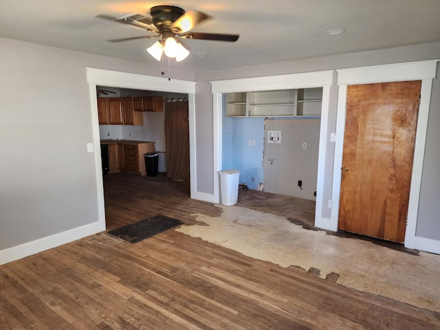 interior space featuring ceiling fan and dark hardwood / wood-style floors