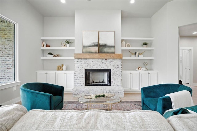 1403 Durham Ave, Wolfforth, TX 79382 - living room featuring light wood-style floors, recessed lighting, and a fireplace