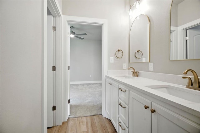 1403 Durham Ave, Wolfforth, TX 79382 - full bath with double vanity, ceiling fan, and wood finished floors