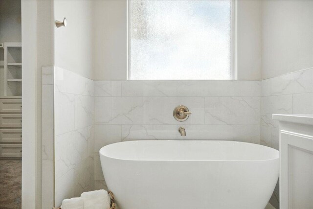 1403 Durham Ave, Wolfforth, TX 79382 - full bath with a freestanding tub and tile walls