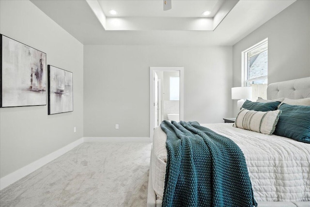 1403 Durham Ave, Wolfforth, TX 79382 - bedroom with a tray ceiling, carpet floors, connected bathroom, and recessed lighting