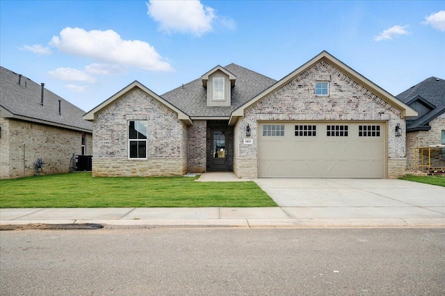 1403 Durham Ave, Wolfforth, TX 79382 - french country inspired facade with a garage, concrete driveway, a front lawn, brick siding, and a shingled roof