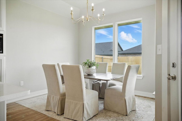 1403 Durham Ave, Wolfforth, TX 79382 - dining room with a chandelier and wood finished floors