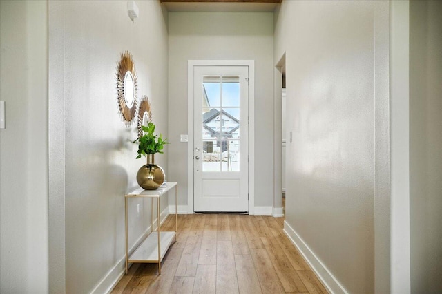 1403 Durham Ave, Wolfforth, TX 79382 - doorway featuring baseboards and light wood-style floors