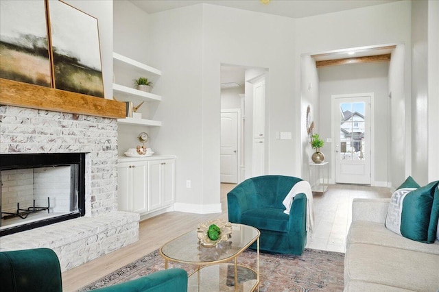 1403 Durham Ave, Wolfforth, TX 79382 - living room featuring wood finished floors and a fireplace