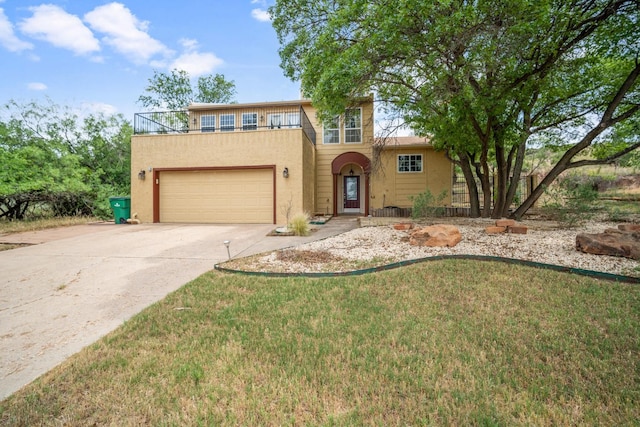 view of front of property with a garage and a front yard