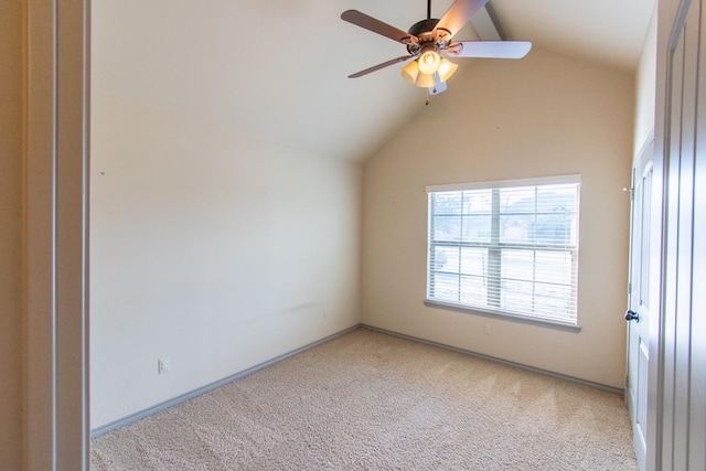 additional living space featuring vaulted ceiling, light colored carpet, and ceiling fan