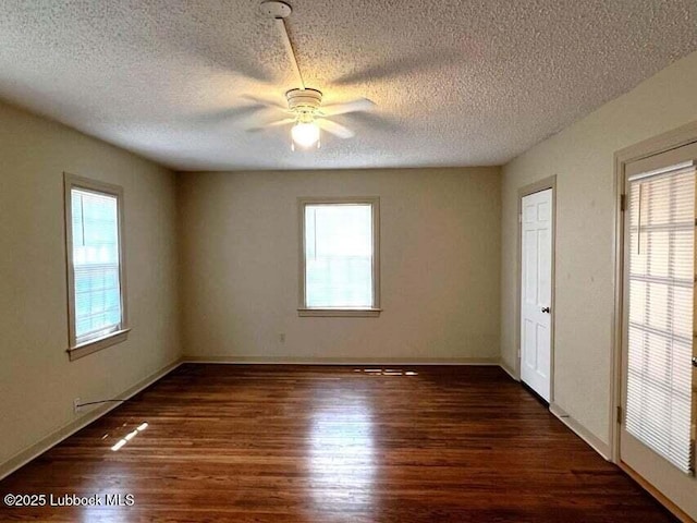 2413 25th St, Lubbock, TX 79411 - spare room featuring wood finished floors, a ceiling fan, a textured ceiling, and baseboards