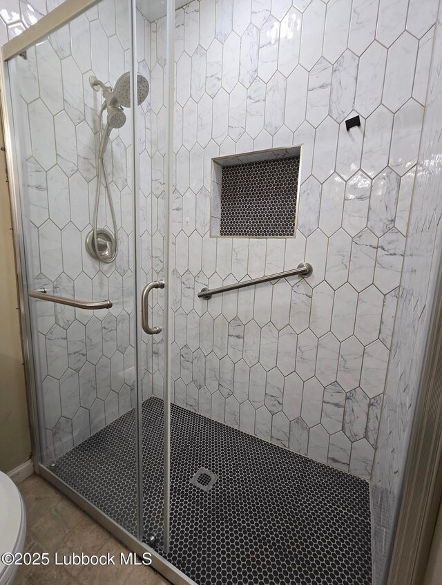 2413 25th St, Lubbock, TX 79411 - full bathroom with a shower stall and toilet
