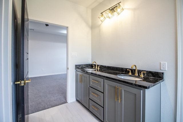 1607 Quincy Ave, Lubbock, TX 79416 - bathroom with double vanity and baseboards