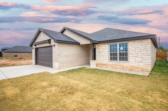 1607 Quincy Ave, Lubbock, TX 79416 - view of front of house with a shingled roof, an attached garage, concrete driveway, stone siding, and brick siding